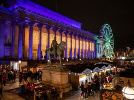Liverpool Christmas Market 2025 wooden chalets at St George's Plateau lit up at night