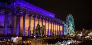 Liverpool Christmas Market 2025 wooden chalets at St George's Plateau lit up at night
