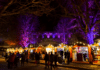 Wooden chalets at Winchester Christmas Market 2025 by the Cathedral