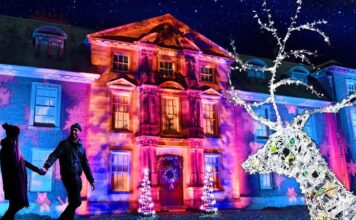 Christmas At Dunham Massey The house lit up at Christmas at Dunham Massey