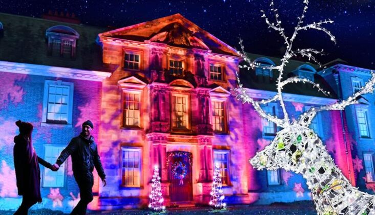 The house lit up at Christmas at Dunham Massey
