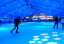People skating at the ice rink at canary wharf.