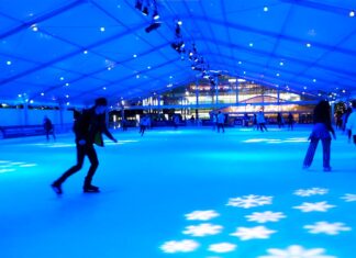 Ice Rink Canary Wharf: The Ultimate 2025/26 Visitor Guide People skating at the ice rink at canary wharf.